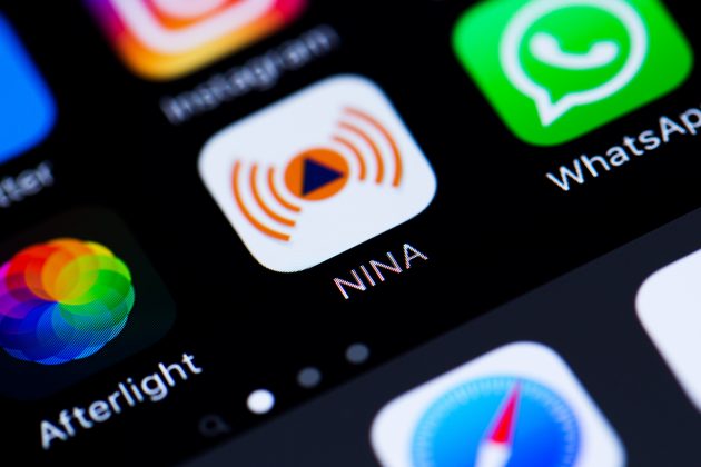 Nina Warnapp Icon im Detail auf einem iPhone Display